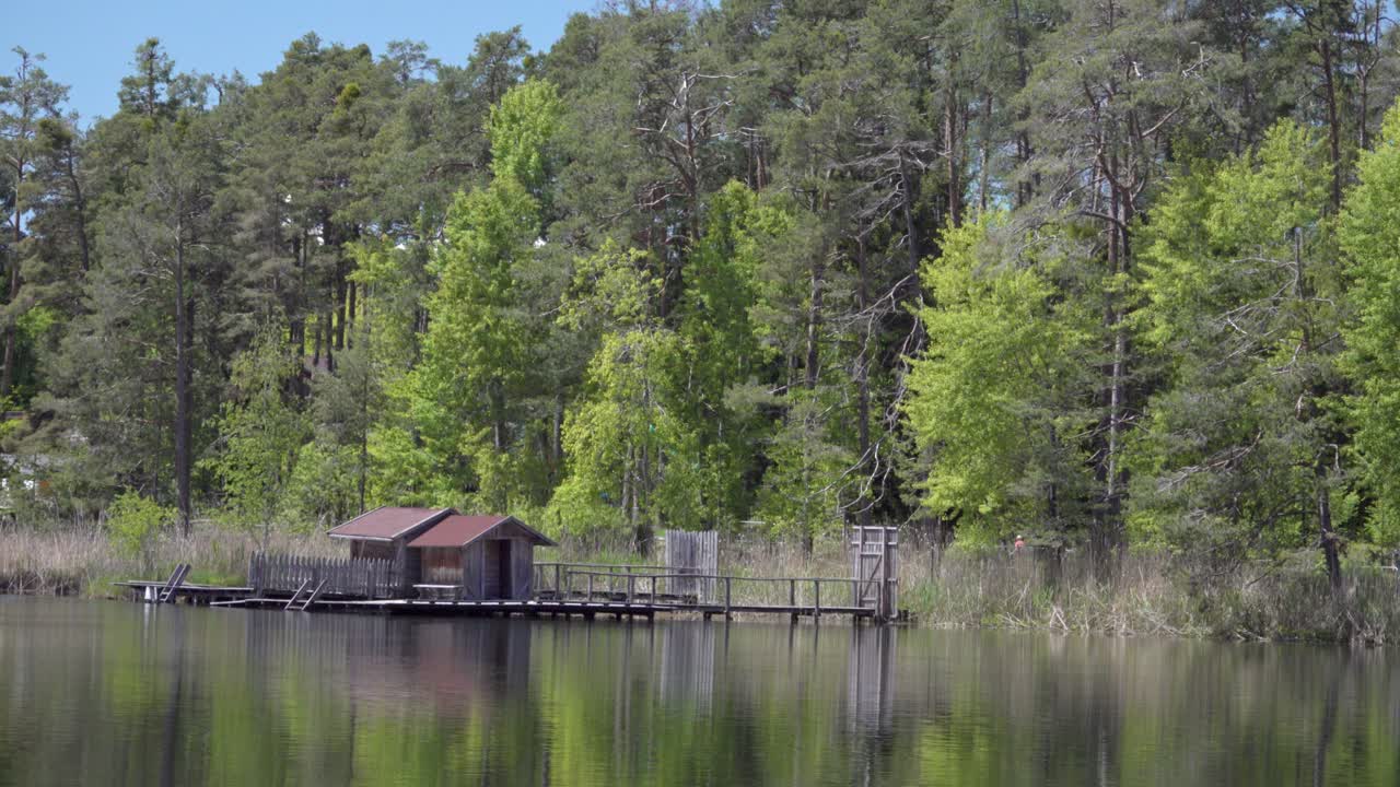 View of part of the pond of Voels - Fiè, South Tyrol, Italy during a warm and sunny day