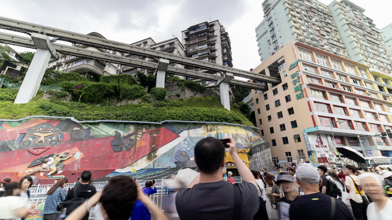 CHONGQING, CHINA - 28 MAY 2025 : train enters liziba station inside a building on bridge in Chongqing china