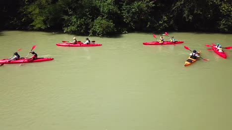 aerial view of people kayaking in pairs on danube river, hungary