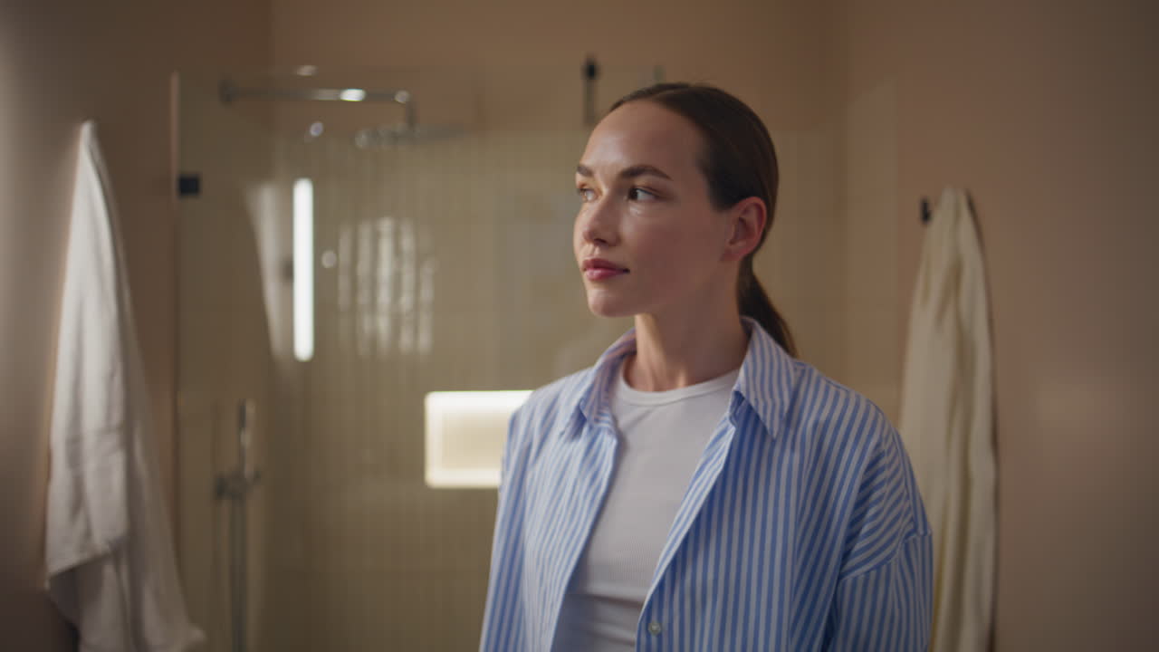 girl get ready in home bathroom. Stylish woman admire beauty in mirror