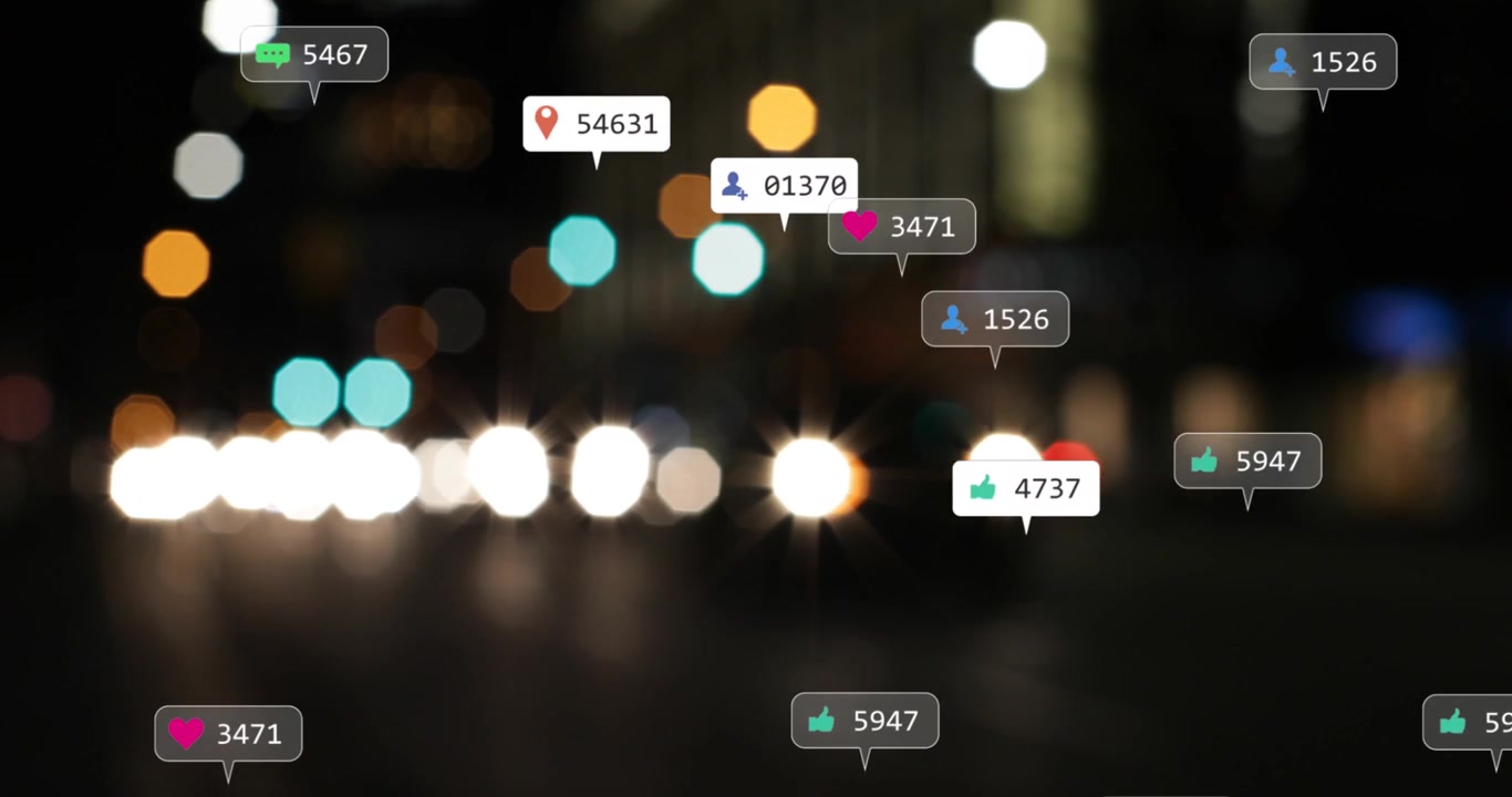 Animation of social media icons and numbers over out of focus city lights