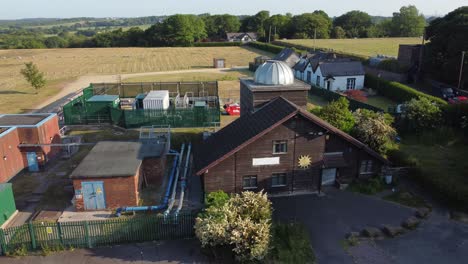 Aerial-view-Pex-hill-Leighton-observatory-silver-dome-rooftop-on-hilltop-rural-farmland-at-sunrise