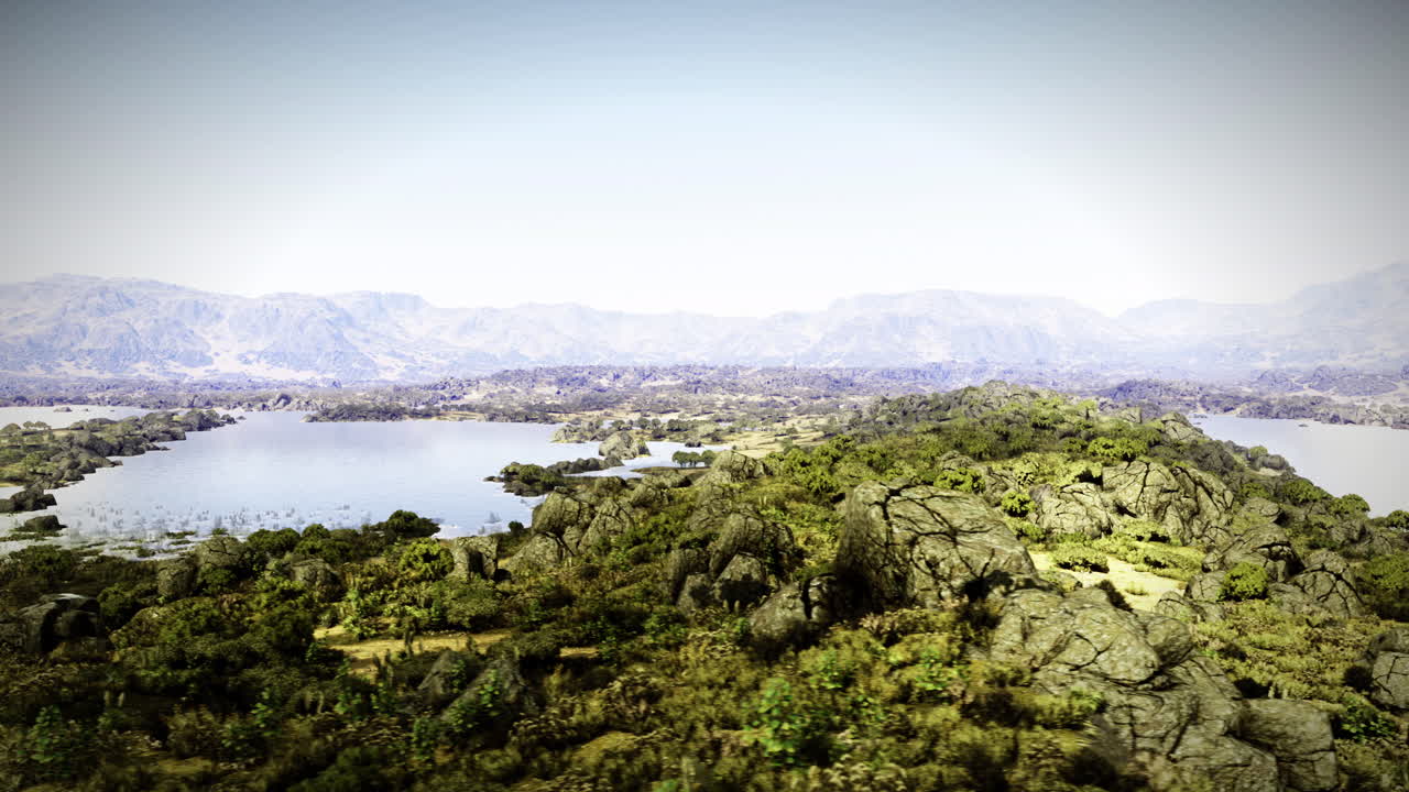 Vibrant landscape with lakes and hills under a clear sky