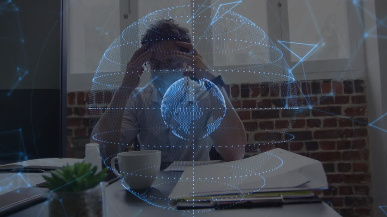 Woman at desk reviewing papers and rubbing temples as blue globe rotating in foreground in business