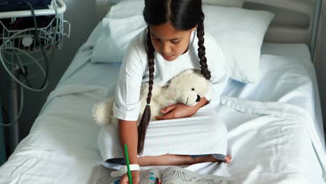 Girl-drawing-picture-in-a-book