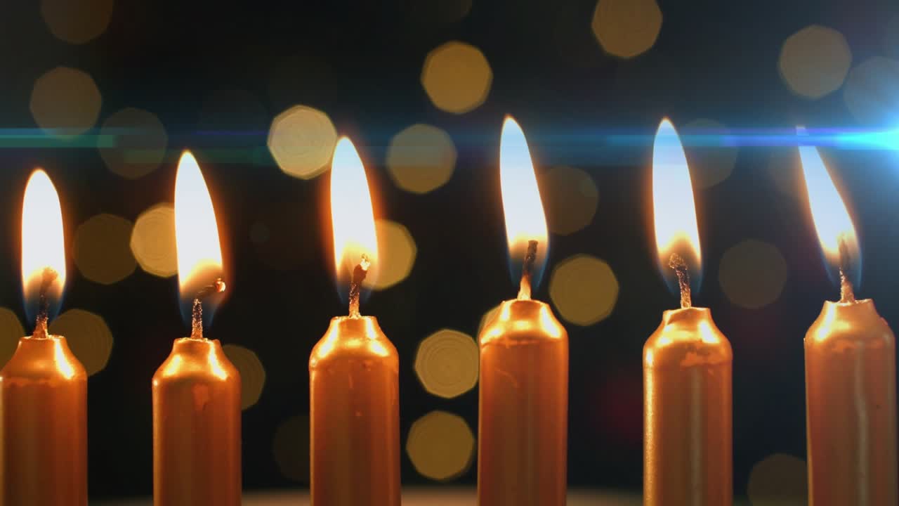 Candle flames dancing and flickering in drafts, lens flare sweeping backdrop creating ambient mood