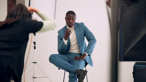 studio portrait of a man in a blue suit