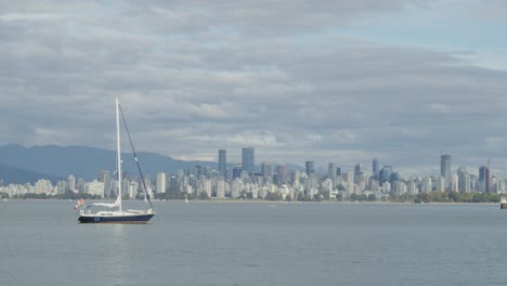 sailboat - downtown vancouver cityscape with moving clouds