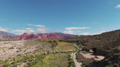 Aerial-side-view-of-magnificent,-colorful,-and-vibrant-mountains-in-Jujuy,-northern-Argentina