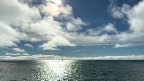 sailboat cruising along the ocean horizon