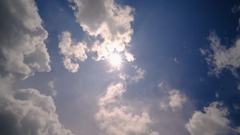 time lapse sun and clouds moving on sky with sun shines and sunbeams