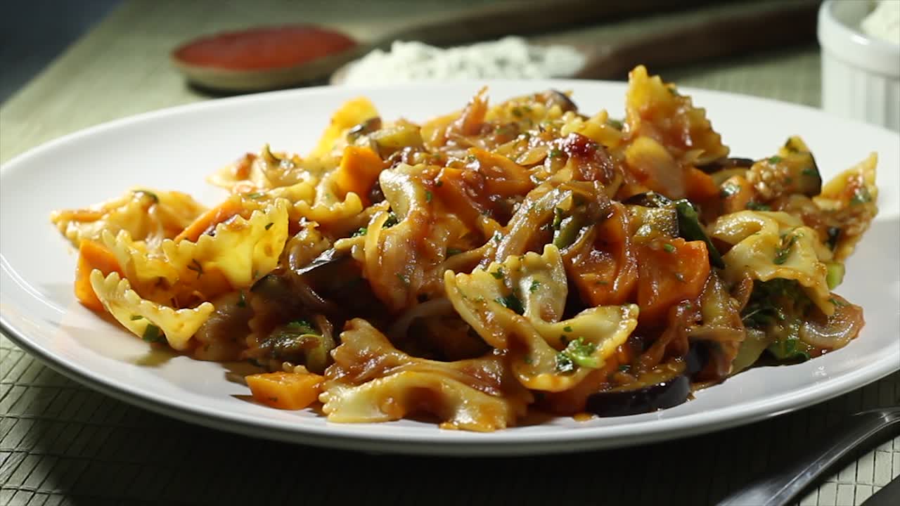Delicious meal on a table with wooden tablecloth and warm smoke coming from the food