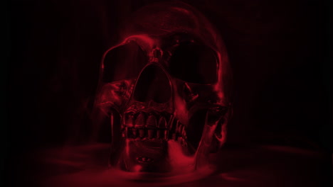 blood red skull on black background, rotating with smoke and mist