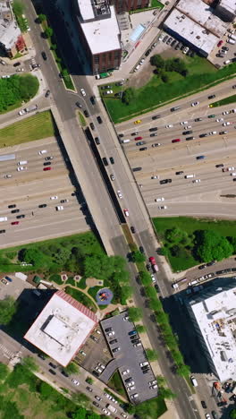 crazy traffic on the busy roads of chicago city. numerous cars moving along diverse motorways. top view. vertical video