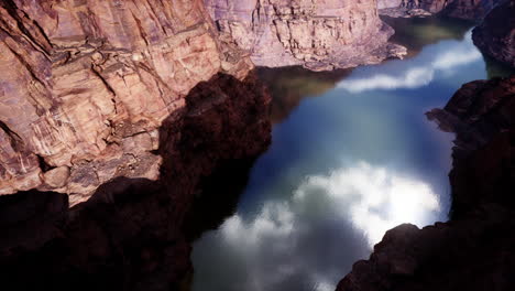 majestic river flowing through a canyon amidst towering mountains