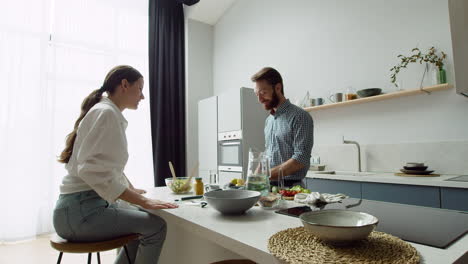 cheerful loving couple in a modern kitchen