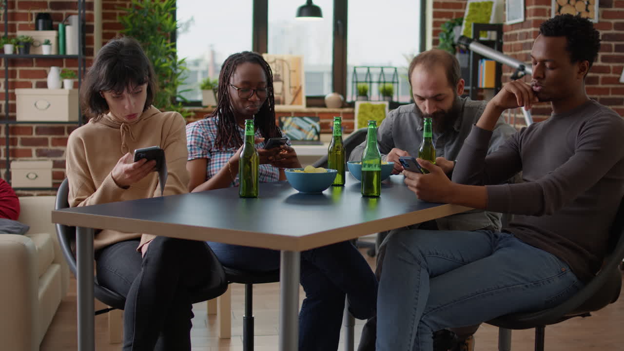 Modern people meeting in living room and using mobile phone
