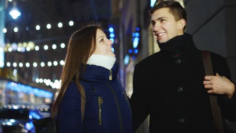 A-young-couple-in-love-walks-through-the-city-at-night