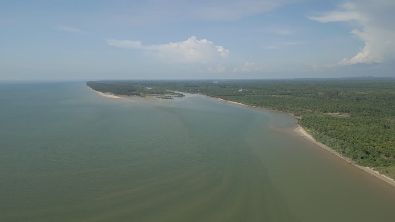 Aerial Drone View During Summer Alit Fishing Village,Kabong With, Facing Open Blue Sea, White Sandy Beach,Green Coconut, Palm Trees,And River,Sarawak,Borneo