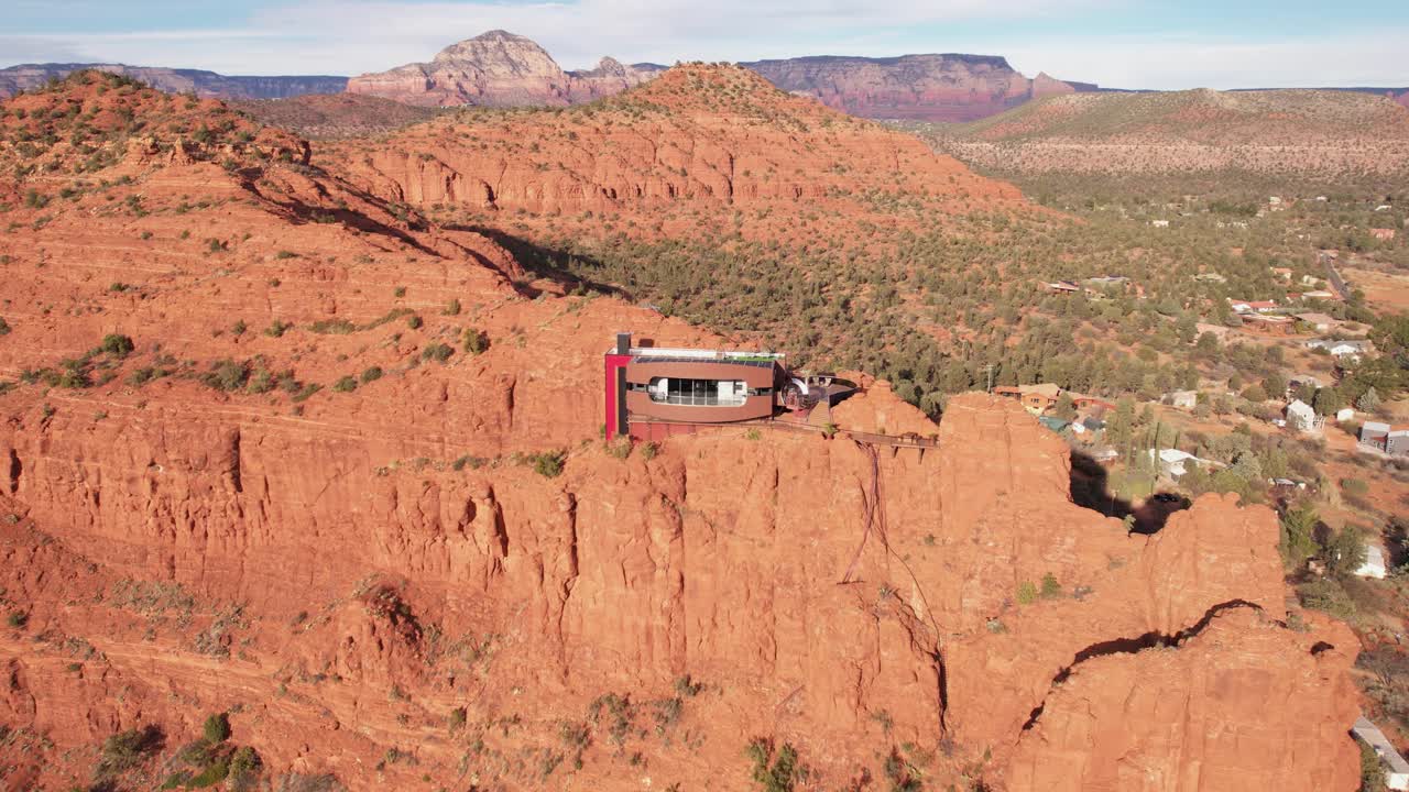 Aerial View, Futuristic House Atop of Red Sandstone Cliff Above Sedona Landscape Arizona USA