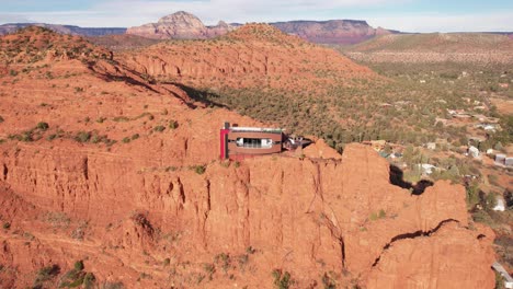 aerial view, futuristic house atop of red sandstone cliff above sedona landscape arizona usa