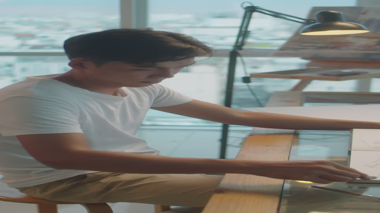 Asian Artist Using Wax Crayons for Drawing Pciture