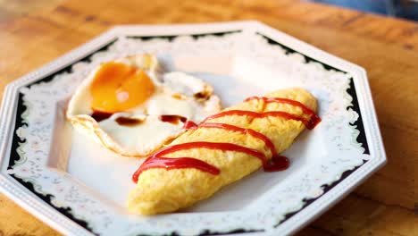 ketchup being drizzled on an omelette