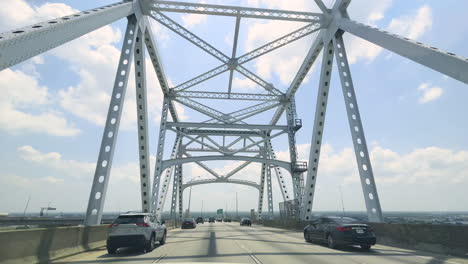 driving on the huey p long bridge toward the city of new orleans