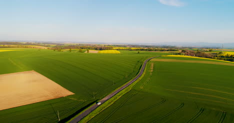 Aerial-Shot-Of-Car-Passing-Road-