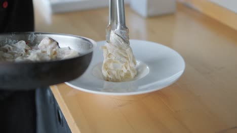 plating fettuccine alfredo with shrimp