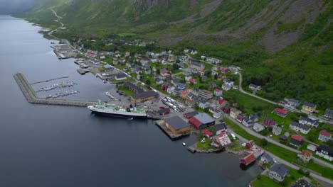 Aerial view of Gryllefjord with a ferry to Andenes, And&oslash;ya, with many cars waiting to board the boat but not enough room which causing a traffic jam
