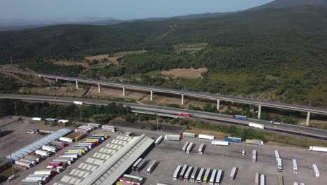 highway, truck stop and scenic landscape aerial view