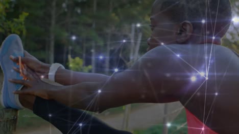 animation of network of connections over woman stretching exercising in forest