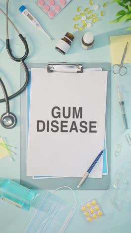 vertical video of gum disease written on medical paper