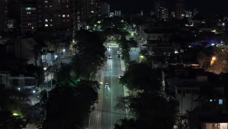 cars driving through scenic road at night with the view of skylines at background, border station of argentina and paraguay at posadas