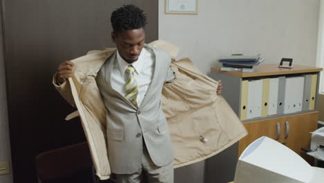 african american businessman entering the vintage office.