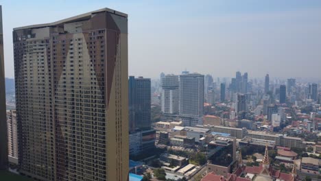 phnom penh city under hazy sky, smog due to air pollution and climate change, aerial view