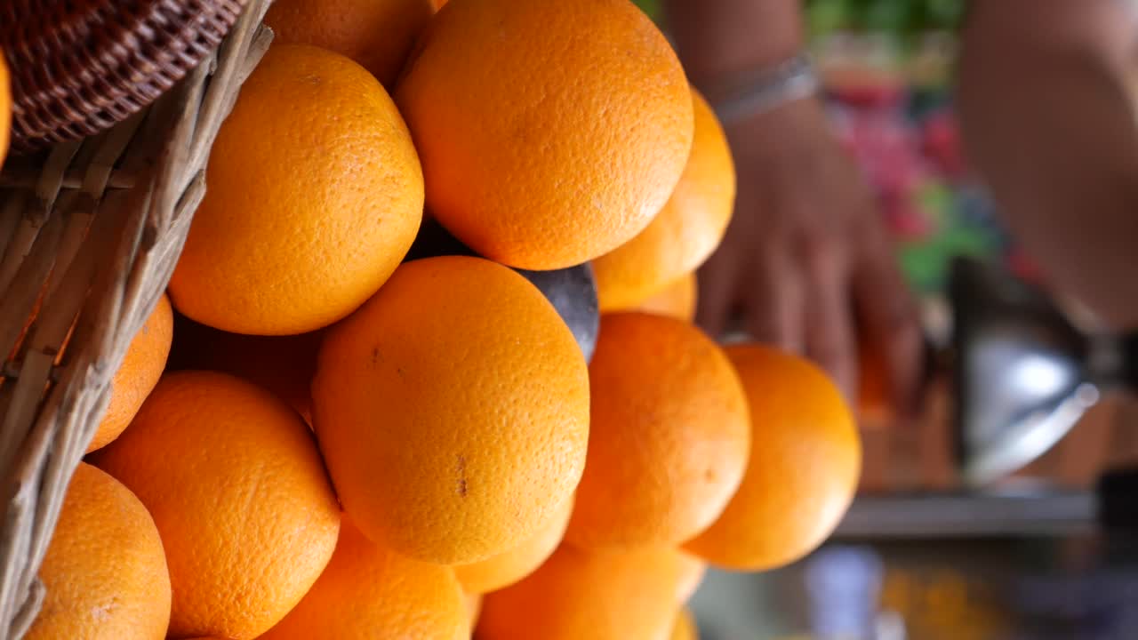 Pile of Fresh Oranges in a Basket