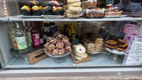 a shop window showcasing baked goods and preserves