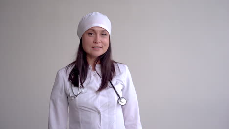 Female-Doctor-With-Surgeon-Cap-And-Heart-Shaped-Hands