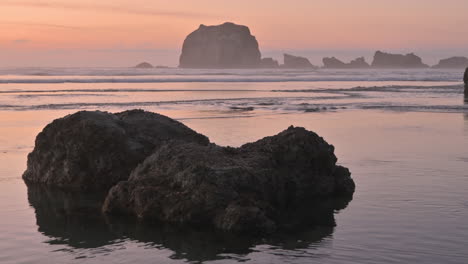 closeup of rock in ocean with ripples in water