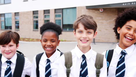 Portrait-Of-High-School-Student-Group-Standing-Outside-School-Buildings-In-A-Line