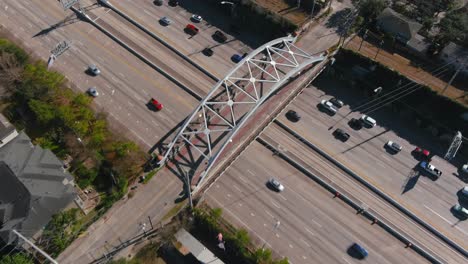 aerial of cars on 59 south freeway in houston, texas on a bright sunny day