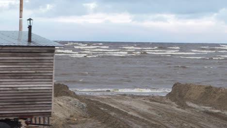 coastal wooden hut on a stormy beach