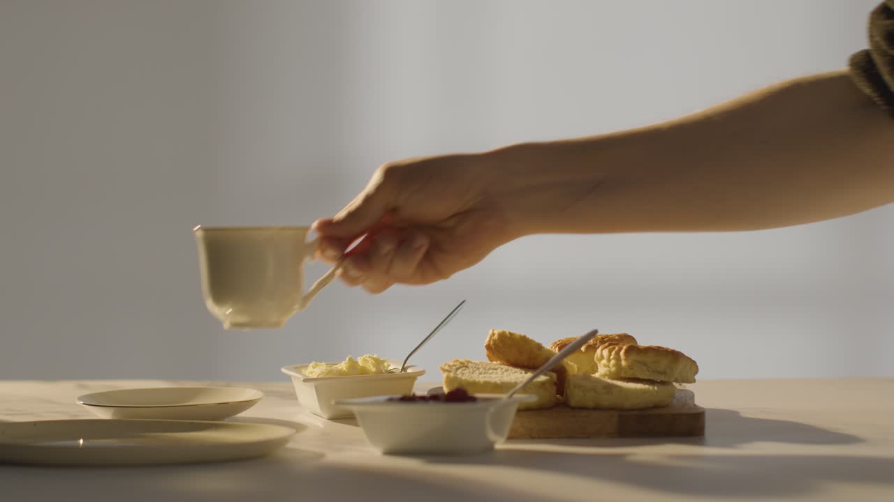 Studio Shot Of Person With Traditional British Afternoon Tea With Scones Cream And Jam 1