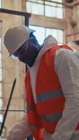 worker in a factory wearing safety gear