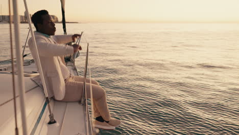 Travel,-freedom-and-sunset-with-black-man-on-yacht