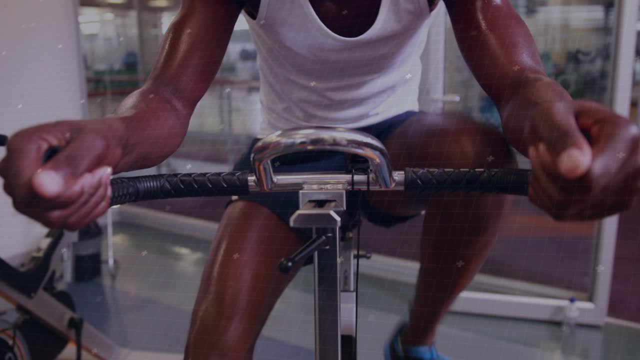 Man gripping handle, starting rowing reps in fitness gym, HUD pulsing over him showing fitness data