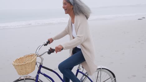 mature woman enjoying time outside by the sea