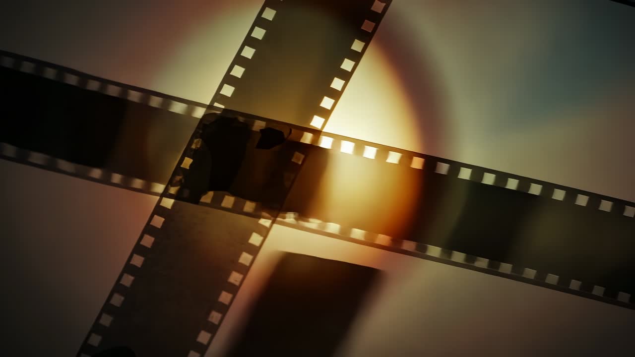 Emerging warm glow initiating negative strips with sprocket holes sliding over plane, pulsing ring